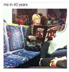 a woman sitting on a train reading a book with the caption me in 50 years