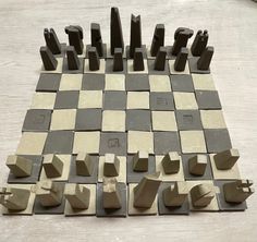 a chess board made out of cement blocks