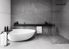 a white bath tub sitting next to a walk in shower