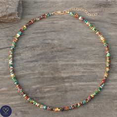 This delicate adjustable necklace makes a wonderful gift for yourself, friend or loved one.      Multi coloured Jasper beaded necklace with rose gold plated alloy spacer beads , Natural Stones , Adjustable . Boho style      Jade size ; 2X4mm       Size: Around 16 inches   Jasper sustains and supports through times of stress, and brings tranquility and wholeness. It provides protection and absorbs negative energy.       Please note: All natural stone will have slight color difference. Each stone is unique in its color variations and texture due to the natural difference in the stones themselves.       Do not expose to chemicals like deodorants or perfumes       Disclaimer: Stones  are not intended to diagnose, treat, cure or prevent any diseases.       NOTE: This necklace is not a machine m Spiritual Heishi Bead Necklace For Gift, Gift Gemstone Beaded Necklaces With Heishi Beads, Gift Gemstone Heishi Beads Necklace, Gift Gemstone And Heishi Beads Necklace, Multicolor Dainty Beaded Necklace For Gift, Green Heishi Beads Necklace For Gift, Dainty Heishi Beads Jewelry For Gifts, Tibetan Necklace, Natural Stone Beads