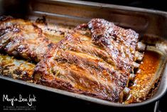 two pieces of meat in a pan covered with sauce and powdered sugar, ready to be cooked