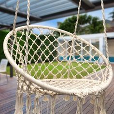 a hammock hanging from a wooden deck