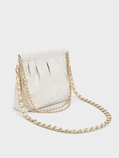 In classic white for maximum style mileage, this match-all version of our Duo shoulder bag is one you will want to wear on repeat. Featuring a seamless magnetic closure that opens up into a roomy interior, this bag is perfectly sized to keep all your daily essentials and then some. With a high-shine gold-tone double chain handle and hardware for added polish, it is the perfect piece to complement off-duty outfits and chic ensembles alike. Off Duty Outfits, Size Chart For Kids, Platform Ankle Boots, Charles Keith, Double Chain, On Repeat, Daily Essentials, White Bag, Belt Size