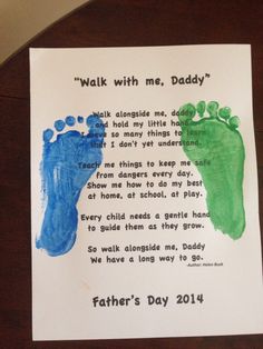 a father's day card with two footprints