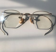 12k Gold Wire Rim Eyeglasses Viopske Lenses Vintage 1950's  Lenses are not scratched  Excellent shape Includes Leather Case Bring back the vintage charm of yesteryear can be displayed on a bookshelf or in a curio cabinet!Disclaimer: All items in our store are vintage and pre-loved, which means they may show signs of gentle wear, including small dings, scratches, or other imperfections that add to their unique character. We do our best to describe and photograph each item accurately, but please f Curio Cabinet, Eye Wear Glasses, Gold Wire, Bring Back, Eyewear Sunglasses, Vintage 1950s, Vintage Charms, Leather Case, Sunglasses Accessories