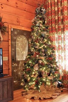 a decorated christmas tree in the corner of a room