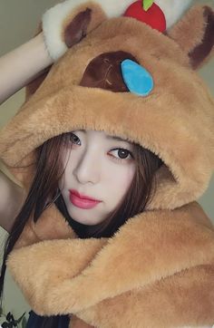 a young woman wearing a teddy bear costume