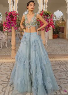 A Sky Full Of Flowers Lehenga Blue Ruffled Lehenga For Party, Bohemian Embellished Sets For Spring, Festive Organza Dress With Floral Applique, Festive Floral Applique Organza Dress, Spring Reception Dress In Organza, Spring Reception Silk Lehenga, Spring Party Lehenga In Organza, Spring Party Organza Lehenga, Bohemian Sequin Wedding Sets