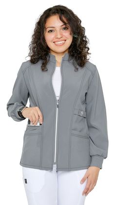 The Dress A Med Women's Stretch Zipper Warm Up Uniform Jacket gives such a complementary look while being useful at work. The jacket has 3 pockets which are perfect for keeping important things with you. You can now look fashionably professional and stay warm while in the workplace. Make your uniform look unique with one of these designer jackets. Pair it with any of our signature scrubs or classic scrub sets. Go ahead and get it now! As standard with every Dress A Med medical uniform, we only u Uniform Jacket, Versatile Office Outerwear With Pockets, Long Sleeve Outerwear With Zipper Pocket For Work, Nurses Uniform Designs Hospitals Dress, Nurses White Uniform Design, Nursing Scrubs Outfits, White Coat Medical, Nurse Zip Up Jacket, Graduation Dresses Long