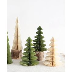 small wooden trees are lined up on the table