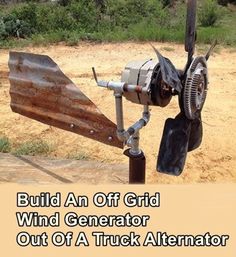 an old wind generator sitting on top of a dirt field with the words build an off grid wind generator out of a truck alteror