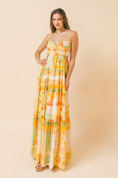 A printed maxi dress featuring plunging V neckline, side cut-out and a tiered skirt. Details Self: 100% Polyester Lining: 100% Polyester Size & Fit - Model is 5`8" And Wearing Size Small - Measurements Taken From Size Small - Approx. Length: 51" Yellow Maxi Dress For Spring, Yellow Floor-length Maxi Dress For Spring, Printed Yellow Maxi Dress, Yellow Printed Maxi Dress For Party, Summer Yellow Printed Maxi Dress, Yellow Printed V-neck Maxi Dress, Yellow Floral Print Floor-length Maxi Dress, Orange Maxi Dress For Brunch, Yellow Maxi Dress For Brunch