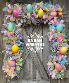 an easter wreath with colorful eggs and bows