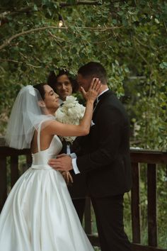 the bride and groom are posing for pictures