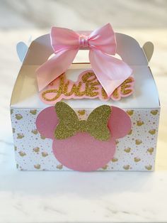 there is a pink and gold minnie mouse box