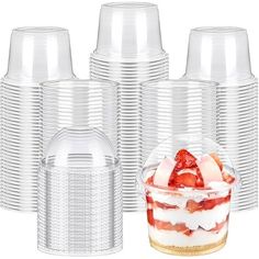 clear plastic cups with strawberries in the middle and on each cupcake liners