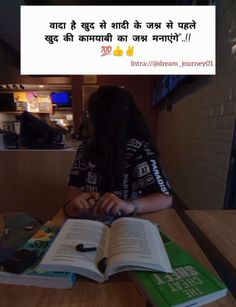 a woman sitting at a table with an open book in front of her and the caption reads,