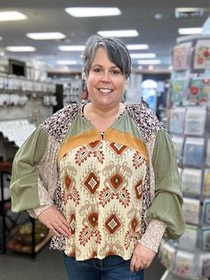 Get ready to make a statement with our Button Front Mixed Print Blouse! This fun top features long sleeves and a v-neckline, perfect for any occasion. With drop shoulders and a playful mixed print design, you'll stand out in all the best ways. (Warning: may cause numerous compliments!) 100% Rayon Jen is wearing her true size XL. Trendy Split Neck Blouse For Fall, Trendy Split Neck Fall Blouse, Multicolor Long Sleeve Tops With Unique Print, Fall Bohemian Split Neck Tops, Green Abstract Print Tops For Fall, Long Sleeve Tops With Unique Print For Spring, Printed Long Sleeve Peasant Top For Fall, Multicolor Tops With Unique Print For Fall, Trendy Boho Print Tops For Fall