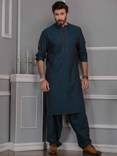 <p>Color: Midnight green<br />Gorgeous kurta features embroidery details on collar and around placket<br />Complement with matching shalwar</p> <p><br /><br /><strong>Additional Accessories:</strong><br />Peshawari Sandal / Khussa: <strong>US$50</strong></p> Salwar Kameez Designs Latest Pakistani, Eid Shalwar Kameez, Eid Outfits Pakistani, Kameez Design, Shalwar Kameez Pakistani, Shalwar Kameez Designs, Pakistani Wear, Plain Kurta, Shalwar Suit