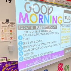 there is a large screen in the classroom with words on it and instructions for good morning