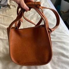 Brand New Madewell Purse. Shoulder Strap And Brass Hardware. Genuine Leather. Used Once. Leather Tan Bucket Bag For Errands, Tan Leather Bucket Bag For Errands, Tan Bucket Bag For Everyday Use, Tan Crossbody Bucket Bag With Removable Pouch, Tan Leather Bucket Shoulder Bag, Leather Rectangular Saddle Bag For Shopping, Rectangular Leather Saddle Bag For Shopping, Classic Leather Saddle Bag For Shopping, Everyday Tan Leather Satchel