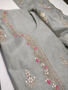 Item Overview ATHARVA Hand Embroidery Salwar Kameez/Grey/Chanderi Silk/Gota Pati Chiffon Chinon Dupatta/Custom Stitch Unstitch/Churridar/Anarkali/Gift/ Dno. CH1804 Fabric: * Shirt - Chanderi Silk- Hand Embroidered Neck 2.5 Mts - Beautiful Hand Embroidery * Dupatta: Chiffon Chinnon Dupatta- All over Exclusive Gota Patti Embroidery - 2.5 Mts- Latkans Tassels * Bottom Santoon Silk 2.5 Mts. Excusive Hand Embroidered Party Wear Punjabi Suit. Customization: * Fabrics Customization: Designs Can be made Embroidery On Grey Fabric, Bollywood Style Gray Semi-stitched Traditional Wear, Gray Traditional Wear For Festive Occasions, Gray Festive Traditional Wear, Festive Gray Traditional Wear, Semi-stitched Gray Traditional Wear With Zari Work, Gray Traditional Wear For Diwali, Traditional Gray Dupatta With Traditional Drape, Traditional Gray Dupatta