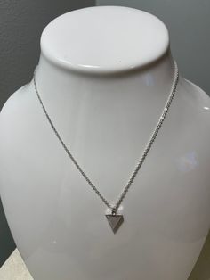 Add a touch of geometric charm with our Tot Tri necklace. Featuring a delicate silver chain, an adjustable clasp allows for the perfect fit. Complete with a tiny triangle pendant, this necklace is a stylish addition to any outfit. (Triangles never go out of style!) *All accessories, jewelry, holiday items, sale items and cocktail mixers are FINAL SALE. Cocktail Mixers, Triangle Pendant, Holiday Items, Kimono Jacket, Anklet Jewelry, Jumper Dress, Accessories Jewelry, Go Out, Bracelet Gift