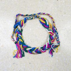 Necklace made of 12 pieces of hand-woven strings, braided into a loose braid. Self-tie necklace. circumference min. 45cm, max. 75 cm. Fair Trade Multicolor Braided Bracelets For Festivals, Adjustable Woven Necklace Perfect As A Gift, Adjustable Woven Necklace As A Gift, Adjustable Multicolor Fair Trade Friendship Bracelets, Multicolor Braided Jewelry For The Beach, Handmade Multicolor Thread Jewelry, Fair Trade Multicolor Braided Bracelet For Festivals, Multicolor Adjustable Lariat Necklace, Multicolor Braided Jewelry For Beach