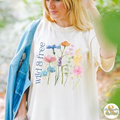 Get ready to be OBSESSED with your new Wildflowers shirt. It's the cutest and most trendy way to emit all those important free spirit vibes! This is the perfect wild & free tshirt! Great gift for the free spirit in your life! Comfort Colors introduces the soft-washed, 100% ring-spun cotton, garment-dyed fabric that brings extra coziness to your wardrobe while the relaxed fit makes it an excellent daily choice. The double-needle stitching throughout the tee makes it highly durable while the lack of side-seams helps the shirt retain its tubular shape.  ❤ The Comfort Colors 1717 tee is made with medium fabric (6.1 oz/yd² (206.8 g/m      consisting of high quality, 100% ring-spun US cotton for long-lasting comfort. ❤ The relaxed fit keeps the wearer comfy in both casual and semi-formal setting Cute Multicolor T-shirt For Spring, Spring Relaxed Fit T-shirt With Watercolor Print, White Watercolor Print Short Sleeve Top, Multicolor Watercolor Print Top For Spring, Spring Multicolor Watercolor Print Top, Multicolor Watercolor Print Tops For Spring, Multicolor Watercolor Print T-shirt For Spring, Spring Multicolor Floral Print T-shirt, Multicolor Floral Print T-shirt For Spring