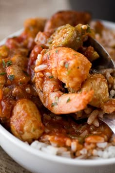 a white bowl filled with shrimp and rice