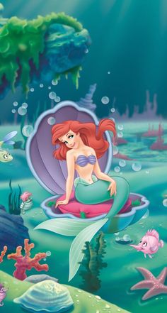 the little mermaid is sitting on an inflatable shell under the water's surface