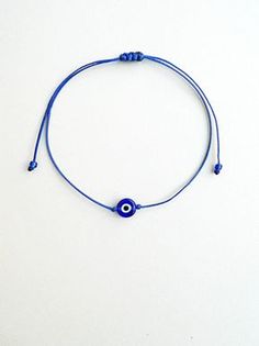 Minimalist Adjustable Beaded Bracelets With Evil Eye, Minimalist Adjustable Evil Eye Bracelet As Gift, Blue Minimalist Jewelry With Sliding Knot, Minimalist Blue Jewelry With Sliding Knot, Minimalist Evil Eye Beaded Bracelets As Gift, Minimalist Evil Eye Bracelet For Everyday, Blue Resizable Evil Eye Bracelet, Minimalist Beaded Bracelet With Evil Eye For Gift, Minimalist Adjustable Evil Eye Bracelet