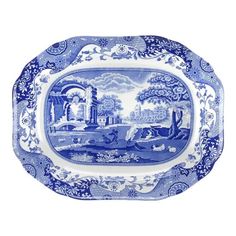 a blue and white plate with a landscape on it