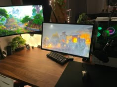 two computer monitors sitting next to each other on top of a wooden desk with a keyboard and mouse