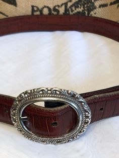 vintage beautiful leather belt by Brighton two tone Cocoa brown and black leather reversible silver belt buckle and silver accents tagged Brighton measures in very good preowned condition shows minimal wear Leather Concho Belt Buckles For Formal Wear, Classic Concho Belt Buckles For Formal Wear, Formal Leather Concho Belt, Silver Belt With Buckle Closure For Formal Occasions, Classic Brown Belt Buckles With Silver Buckle, Vintage Formal Belts With Silver Buckle, Elegant Brown Belt With Silver Buckle, Vintage Silver Leather Belt Buckles, Silver Leather Belt With Antique Buckle