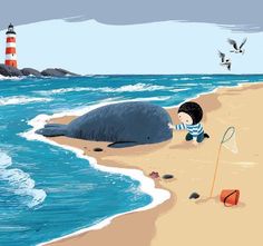 a boy is playing with a whale on the beach