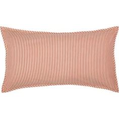 a pink and white striped pillow with an orange stripe pattern on the front, along with a