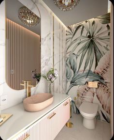 a bathroom with marble counter tops and wallpaper on the walls, along with a gold faucet