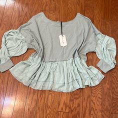 Nwt - Sea Green Peasant Top/ Size Large By Vine & Love/ New Condition/ One Pin Hole On The Side See Last Photo Spring Bohemian Green Peasant Top, Green Fitted Casual Peasant Top, Green Long Sleeve Peasant Blouse, Pink Satin Blouse, Balloon Top, Casual Green V-neck Peasant Top, Spring V-neck Peasant Top With Gathered Sleeves, Embroidered Cactus, Ruffle Trim Top