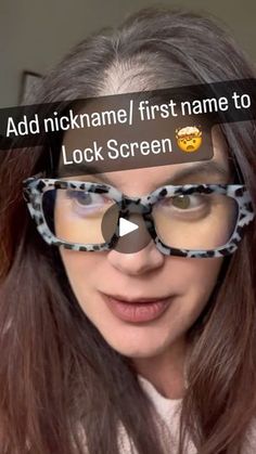 a woman with glasses looking at the camera and texting her name to lock screen