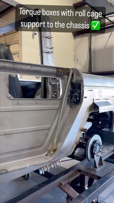 an image of a car being worked on in a garage with the words torque boxes with roll cage support to the chassis