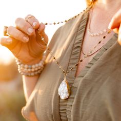 The look of 3 layered necklaces in 1! The focal pendant is an electroplated White Druzy in 18k. It combines with 3 chain styles that compliment one another in a seamless fashion. This necklace is perfect with a tshirt or a bohemian style maxi dress. This item will ship with gemstone information on the Santore Jewelry Card included with purchase.⬩25-40mm Tear shape Pendant⬩32-inch, 24-inch, 18 inch Brass, Plated Brass, and Gemstone Chain Necklace⬩Druzy is known to bring balance, harmony, inner pe Hammered Hoop Earrings, Jewelry Card, Style Maxi Dress, Strand Necklace, Druzy, Chain Styles, Layered Necklaces, Bohemian Style, Moonstone