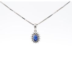 Item Details: - Type: Drop Pendant Necklace  - Metal: 18K White Gold  - Weight: 1.05 Grams (pendant only) - Setting: Prong, Halo ______________________________  Center Stone Details: - Type: Natural Sapphire  - Carat: 1.20  - Cut: Oval  - Color: Blue  - Measurements: 6.5 X 5 MM  ______________________________  Side Stone Details:  - Type: Natural Diamond  - Cut: Round  - Color: G-H - Clarity: SI1-SI2 - Quantity: 14  ______________________________  Dazzling modern drop pendant necklace, featuring a 1.20 carat natural oval cut Sapphire radiating a deep royal blue. This center stone is matched with 14 piece round-cut diamond halo in a star motif pendant made of 18K white gold. Set with an open back to allow for the center stone's natural color to be on full display.   The default order comes Oval Sapphire Necklace With Hallmark, Blue Diamond Oval Pendant Jewelry, Oval Sapphire Necklace With Brilliant Cut, Oval Blue Diamond Cut Necklace, Blue Oval Diamond Cut Necklace, Oval Blue Diamond Necklaces, Blue Oval Diamond Necklaces, Blue Oval Pendant Necklace For Anniversary, Sapphire Oval Necklace With Diamond Cut