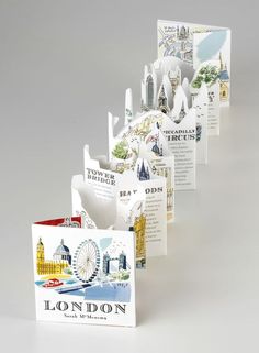 there are many different greeting cards in the same box, each with an image of london on them