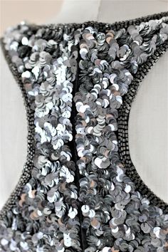 "Fun and Funky, Disco or Party time..this dress has it all... True Trophy ...and with a razor back..oh my!! Excellent condition looks never worn! Measuring: 35\" Length Bust: 34\"+ Waist: 28\" Hip: 36\" Pet Free/smoke free Enjoy!" Backless Sequin Dress For Formal Occasions, Silver Embellished Sequin Fabric For Night Out, Backless Embellished Evening Sequin Dress, Backless Embellished Sequin Evening Dress, Evening Backless Embellished Sequin Dress, Silver Sequin Dress With Contrast For Cocktail, Silver Sequin Dress With Contrast Details For Cocktail, Silver Sequin Cocktail Dress With Contrast Details, Embellished Backless Sequin Fabric For Prom