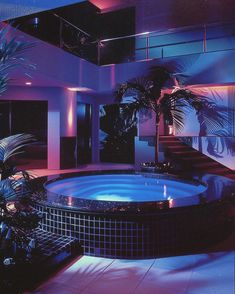 an indoor hot tub surrounded by palm trees