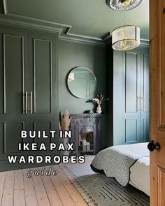 a bedroom with green painted walls and wooden floors is featured in the article built in ikea pax wardrobes