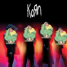 four people standing in front of a black background with the words korn on it