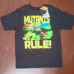 Boys Size Medium Teenage Mutant Ninja T-Shirt. Brand New, With Tags. Smoke Free, Stain Free. I Ship Same Day. Any Questions, Feel Free To Ask! Playful Black T-shirt With Character Print, Playful Black Top With Letter Print, Playful Black Tops With Letter Print, Fun Black Tops With Screen Print, Fun Black T-shirt With Front Print, Fun Black Short Sleeve Shirt, Playful Black Cotton Shirt, Fun Black Pre-shrunk T-shirt, Fun Black Shirt With Character Print