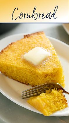 a piece of cornbread on a white plate with a fork next to it and the words cornbread